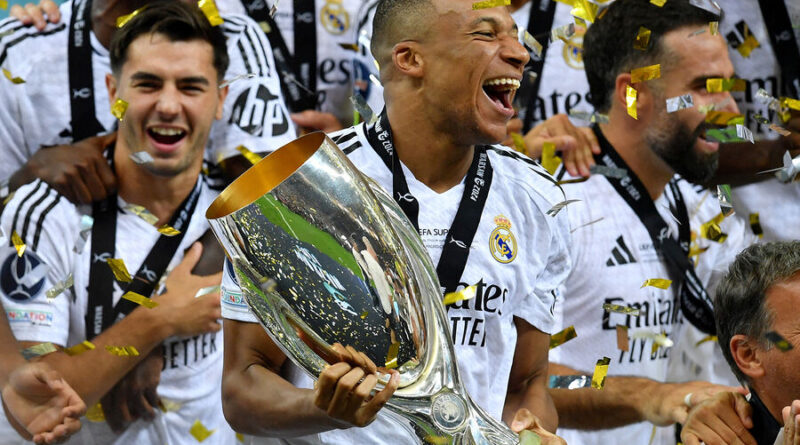 Mbappe holds the European Cup after the win